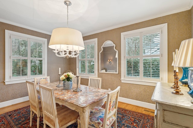 dining room with crown molding, a chandelier, a wealth of natural light, and dark hardwood / wood-style floors