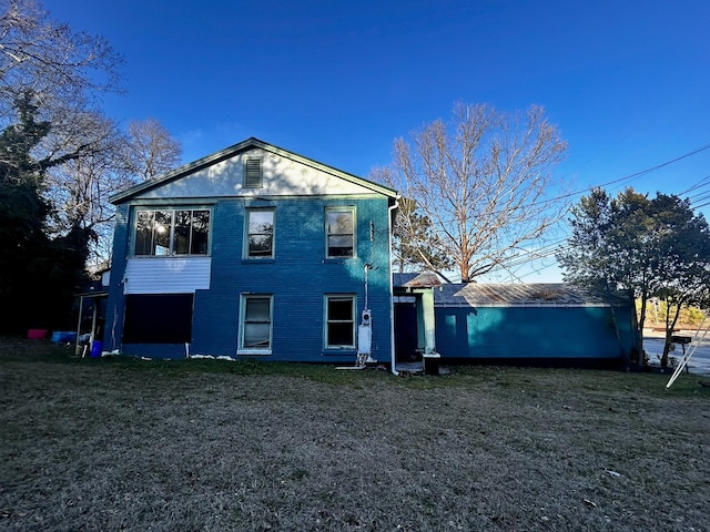 back of house with a yard