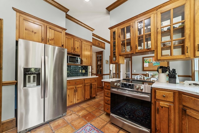 kitchen featuring light tile patterned floors, crown molding, stainless steel appliances, and decorative backsplash