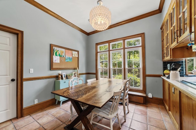 dining space with light tile patterned flooring, an inviting chandelier, and ornamental molding