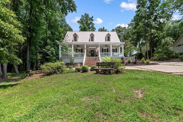 view of front of house with covered porch and a front yard