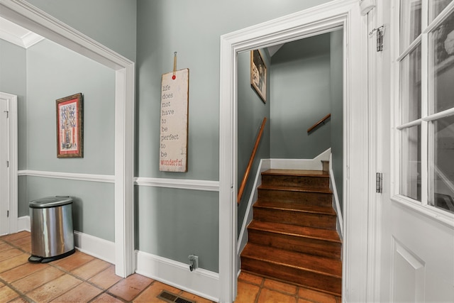 stairs with tile patterned flooring