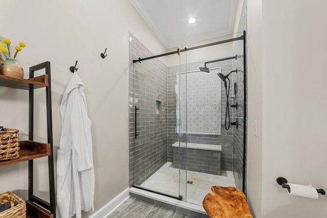 bathroom featuring hardwood / wood-style floors, a shower with door, and ornamental molding