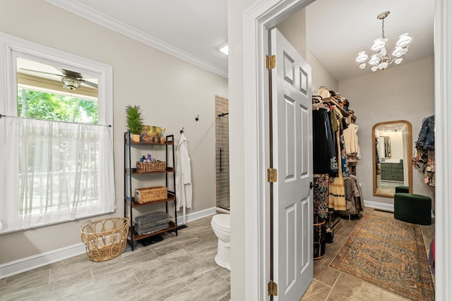 spacious closet with a chandelier