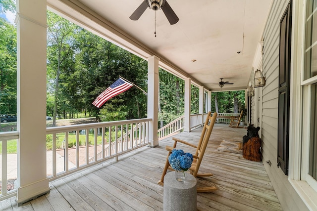 deck featuring ceiling fan and a porch