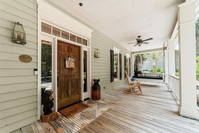 deck featuring ceiling fan and a porch