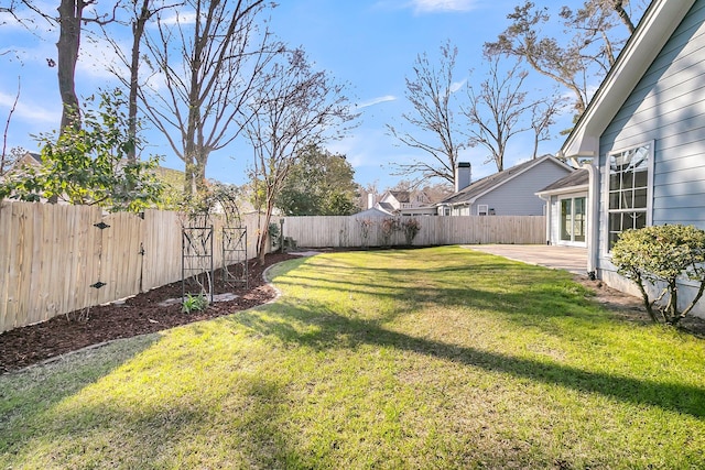 view of yard with a patio area and a fenced backyard