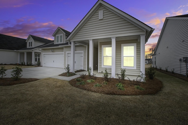 view of front of house with a lawn and a garage