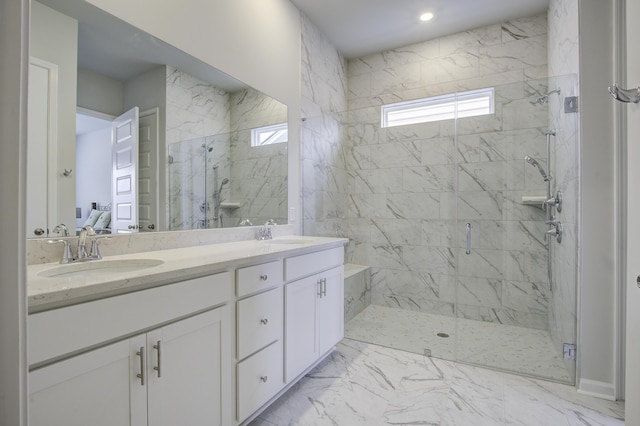 bathroom featuring vanity and a shower with door