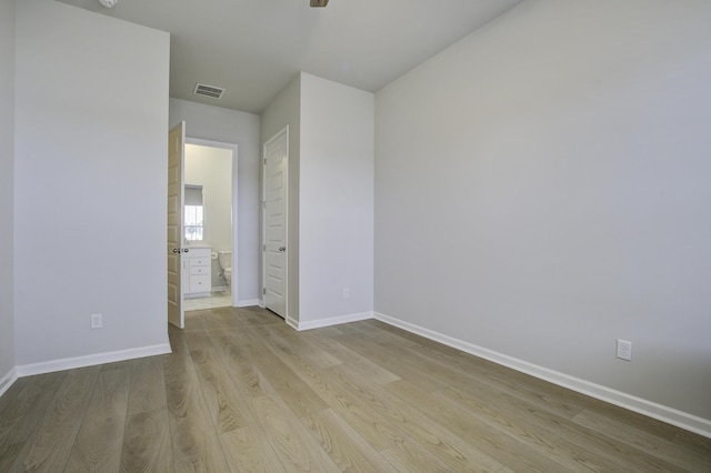 spare room with light wood-type flooring