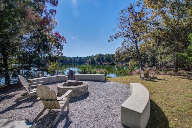 view of patio / terrace featuring a water view and a fire pit