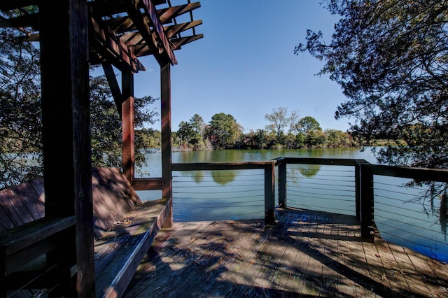 dock area featuring a deck with water view