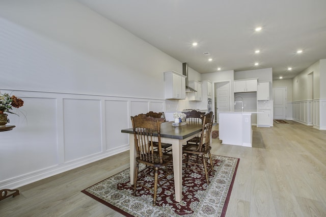 dining room with light wood-type flooring