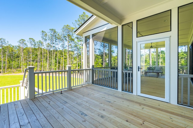 wooden terrace featuring a sunroom