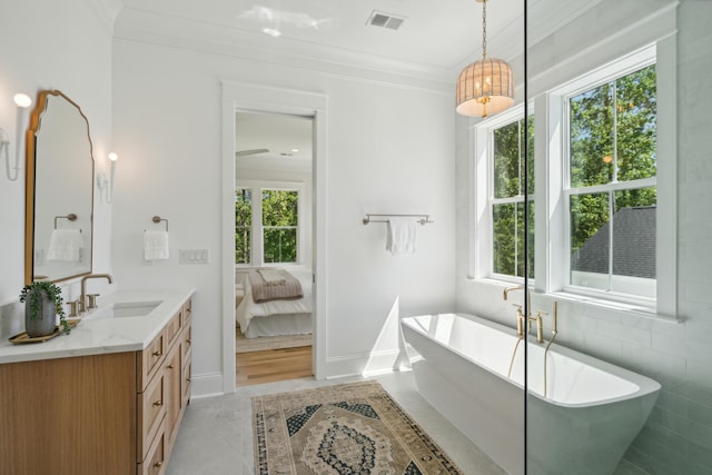 bathroom with hardwood / wood-style flooring, plenty of natural light, and ornamental molding