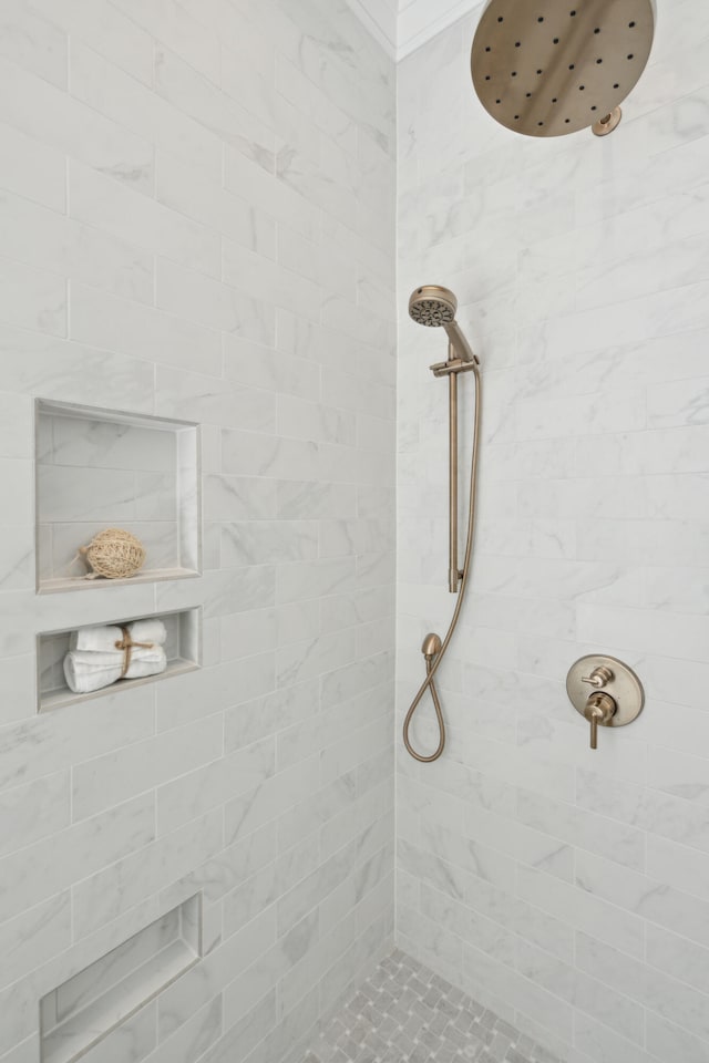 bathroom with a tile shower