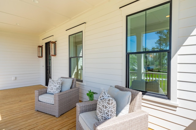 wooden terrace with a porch