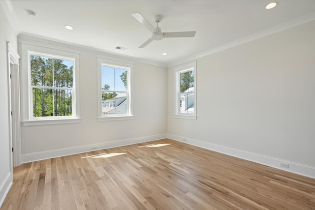 empty room with ornamental molding, light hardwood / wood-style flooring, and ceiling fan