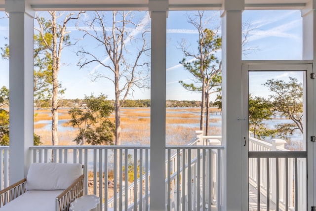 balcony featuring a water view