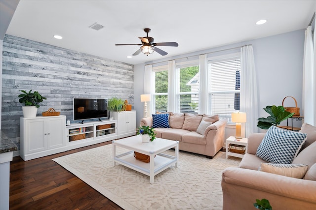 3203 Moonlight Dr, Charleston, SC 29414 - living area featuring recessed lighting, dark wood finished floors, a ceiling fan, an accent wall, and wood walls