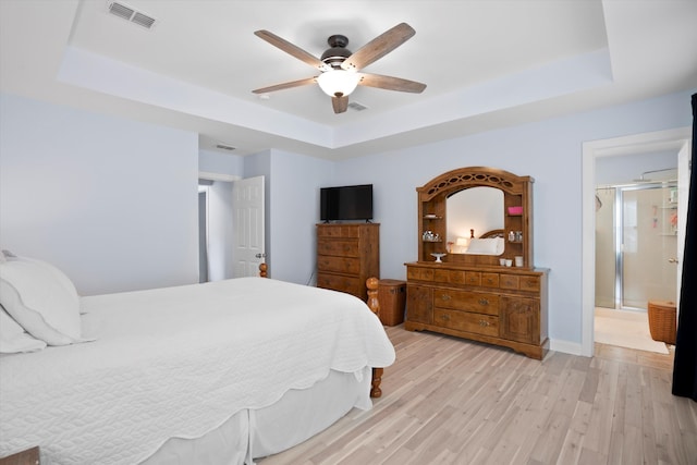 3203 Moonlight Dr, Charleston, SC 29414 - bedroom with a raised ceiling, light wood finished floors, a ceiling fan, and baseboards