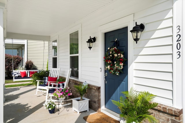 3203 Moonlight Dr, Charleston, SC 29414 - doorway to property featuring covered porch