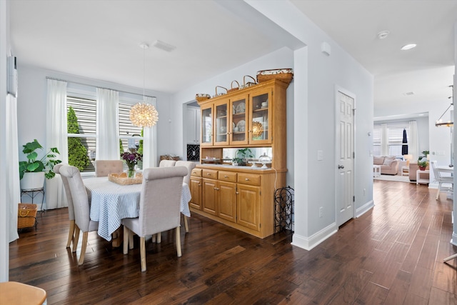 3203 Moonlight Dr, Charleston, SC 29414 - dining room with a chandelier, dark wood-style floors, and baseboards