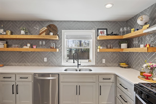 kitchen with open shelves, dishwasher, light countertops, and a sink