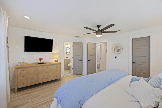 bedroom with a ceiling fan, visible vents, ensuite bath, light wood-style flooring, and recessed lighting