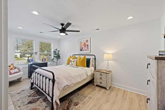 bedroom with visible vents, baseboards, and light wood-style floors