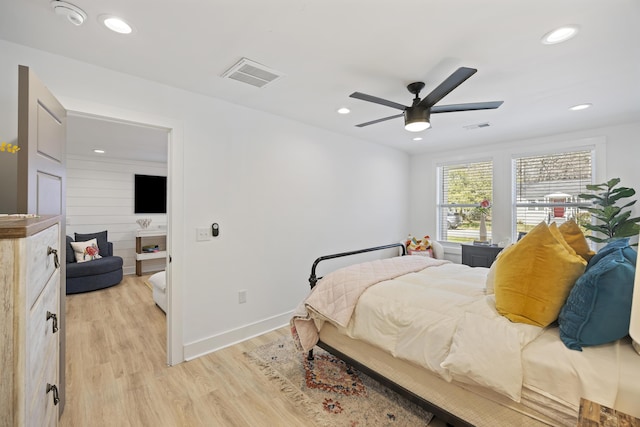 bedroom featuring light wood-style flooring, recessed lighting, visible vents, and baseboards