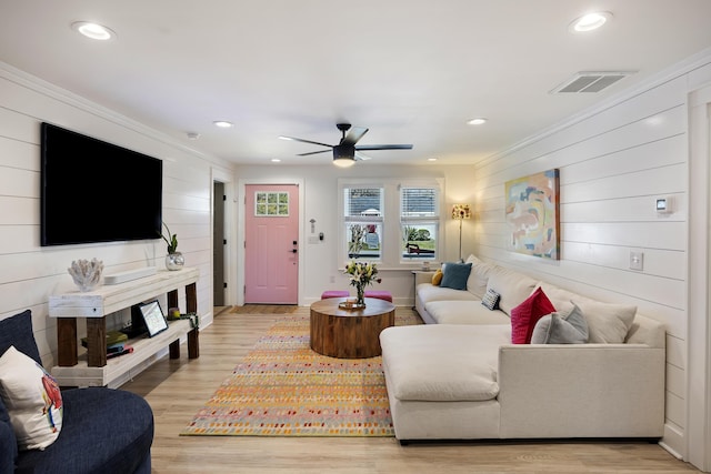 living area featuring visible vents, recessed lighting, and light wood-style floors