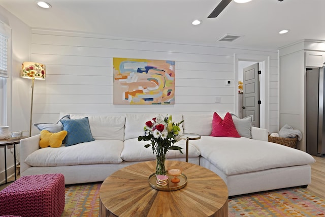 living room with recessed lighting, visible vents, wood finished floors, and ceiling fan