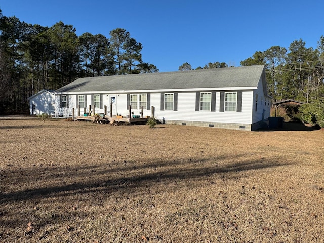 view of front of home with a front yard and crawl space