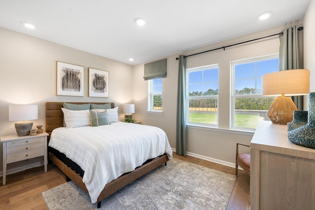 bedroom with light hardwood / wood-style flooring