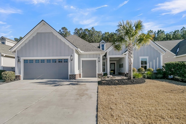 view of front of property featuring a garage and a front yard