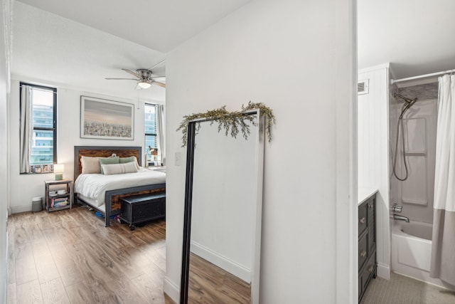 bedroom featuring hardwood / wood-style flooring and ceiling fan