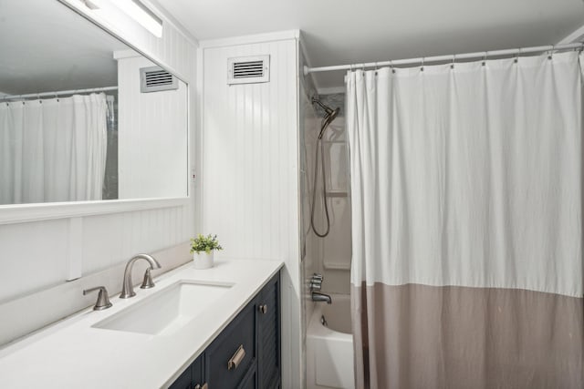 bathroom featuring vanity and shower / bath combo