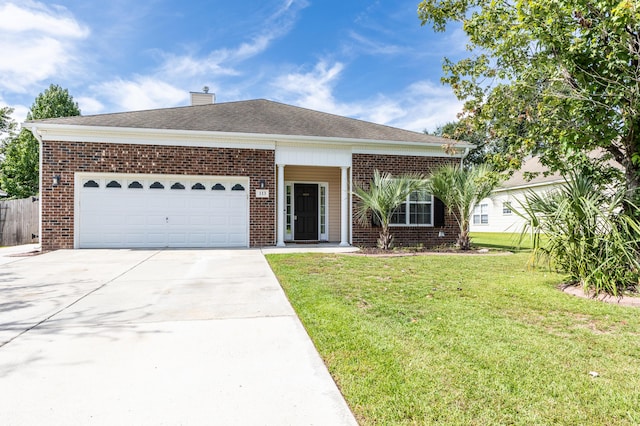 single story home featuring a front yard, brick siding, driveway, and an attached garage