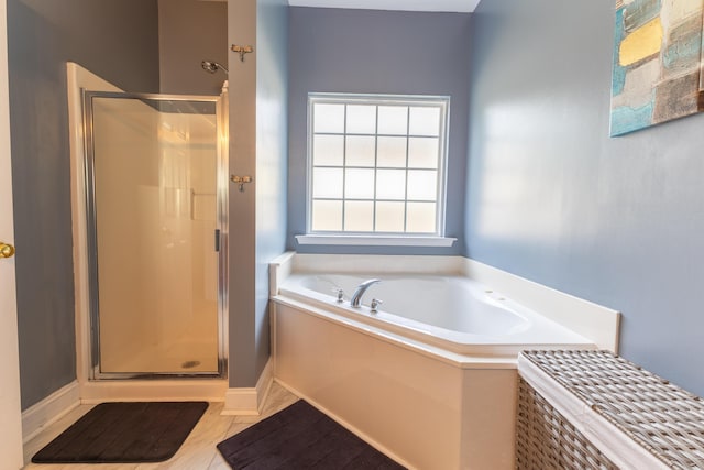 full bathroom with a stall shower and a garden tub