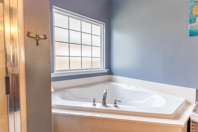 full bathroom with a bath