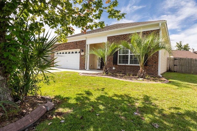 view of front facade featuring a garage, fence, a front lawn, and brick siding