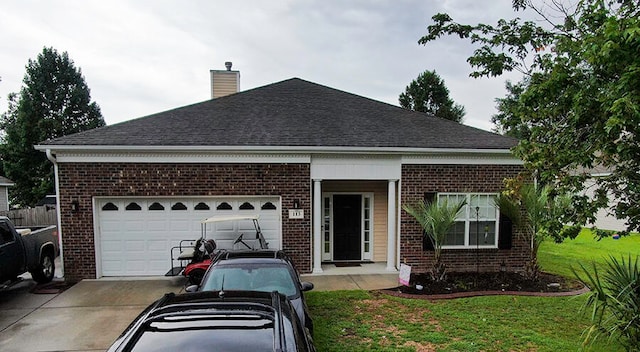 view of front facade with a front lawn and a garage