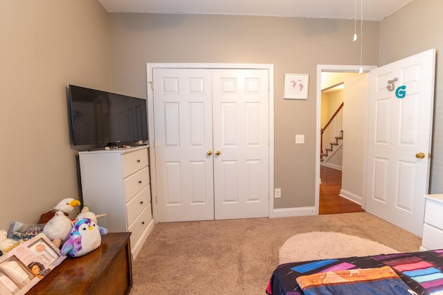 carpeted bedroom featuring a closet