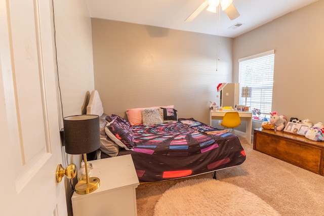 bedroom with ceiling fan, carpet floors, and visible vents