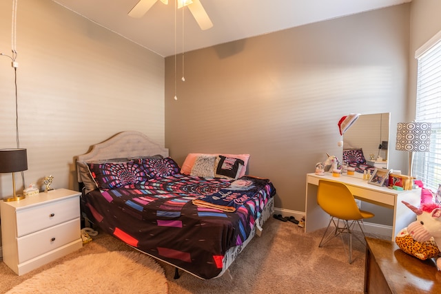 carpeted bedroom with multiple windows and ceiling fan