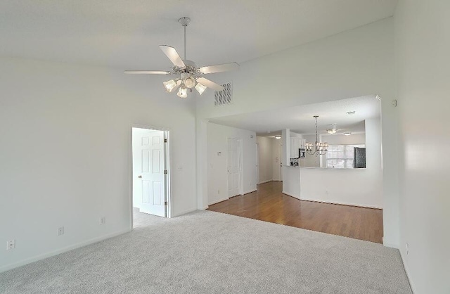 159 Townsend Way, Summerville, SC 29483 - unfurnished living room featuring carpet, a chandelier, a ceiling fan, and high vaulted ceiling