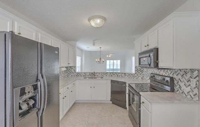 159 Townsend Way, Summerville, SC 29483 - kitchen featuring black appliances, a chandelier, white cabinets, light countertops, and tasteful backsplash