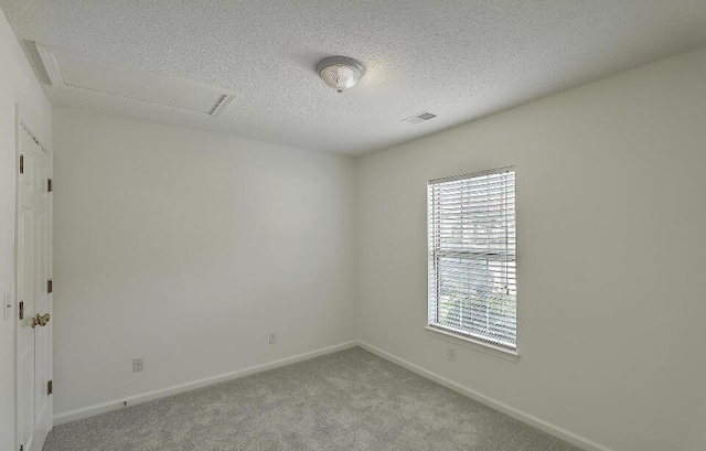 159 Townsend Way, Summerville, SC 29483 - spare room with light carpet, a textured ceiling, and attic access