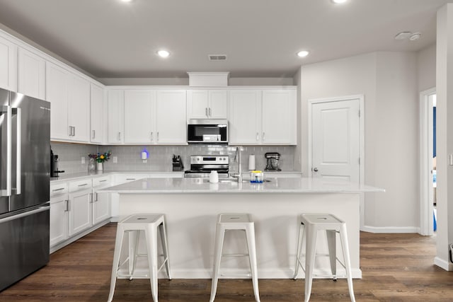215 Cypress Plantation Rd, Moncks Corner, SC 29461 - kitchen with appliances with stainless steel finishes, a breakfast bar, backsplash, and recessed lighting